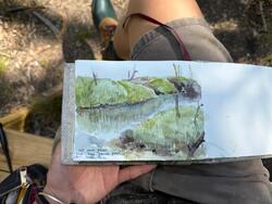 a drawing in a sketchbook of a salt marsh