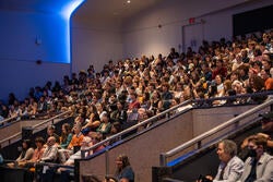 a crowd gathers for a convocation ceremony