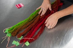 colorful dyed skeins on a metal table