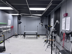 an open space stocked with equipment for studio lighting projects
