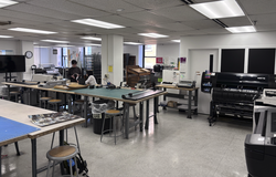 students work in an academic studio space housing a variety of typography equipment