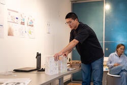 a student shows a drawing he made