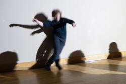 LA Samuelson swoops and dives through a moving light