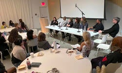 Tessa Haas leads a panel discussion with fellows