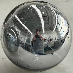 Nathan Wright's reflection in a spherical mirror object