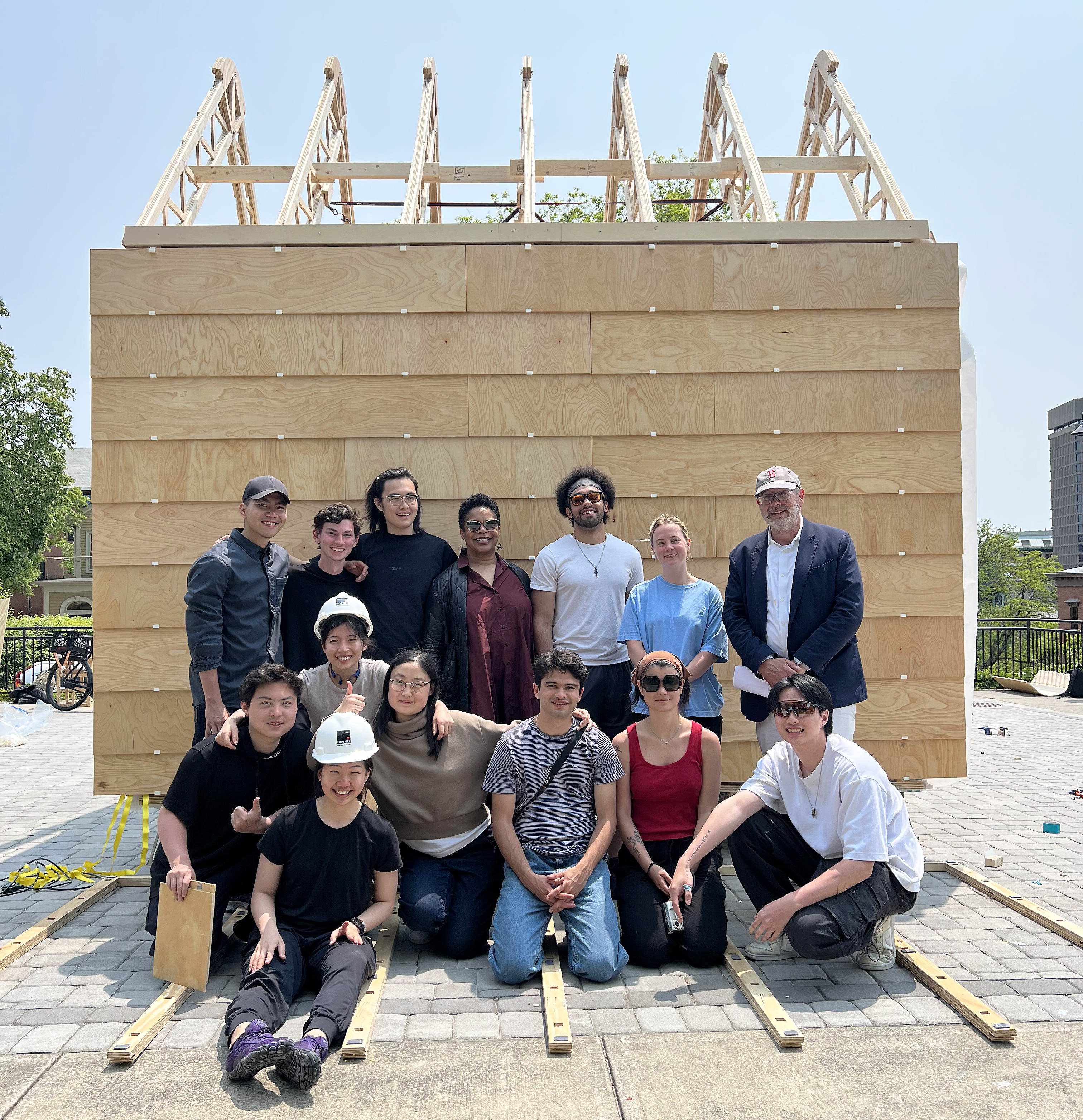 President Williams poses with Architecture students in front of newly built sustainable wall structure