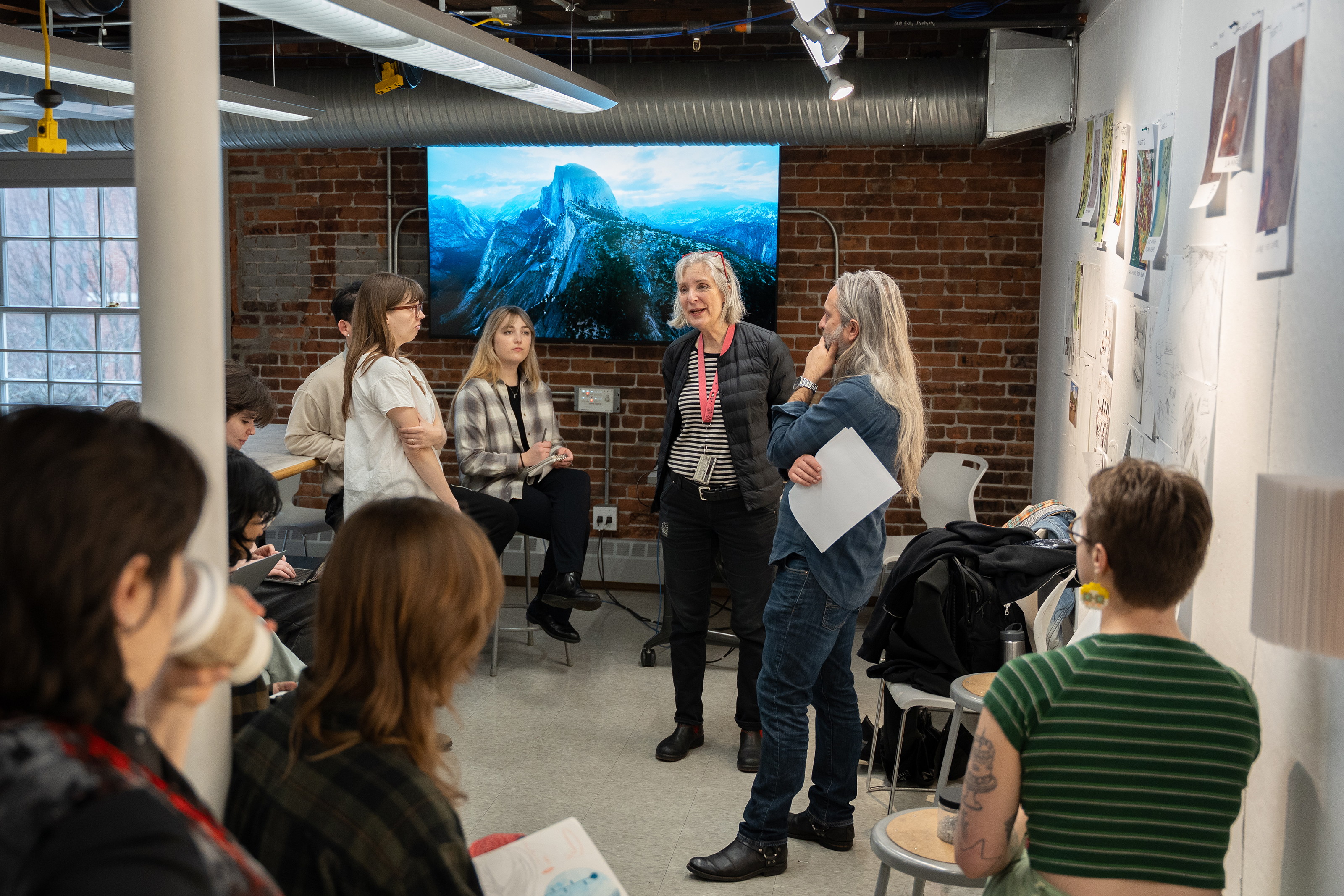 Professor Jean Blackburn addresses the class before a midterm pinup review