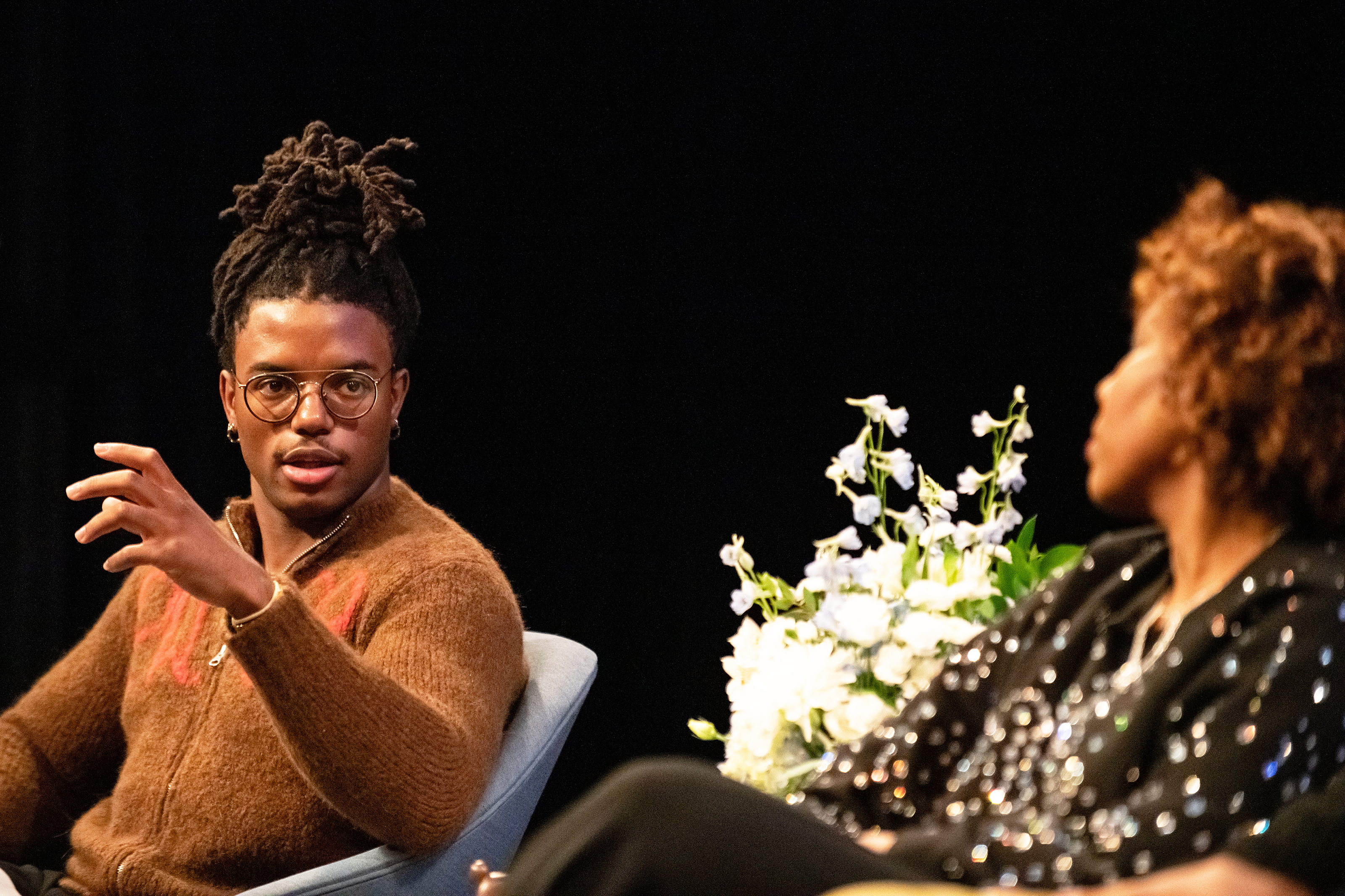 Fifth-year student Njari Anderson offers thoughtful questions as co-moderator of the panel discussion