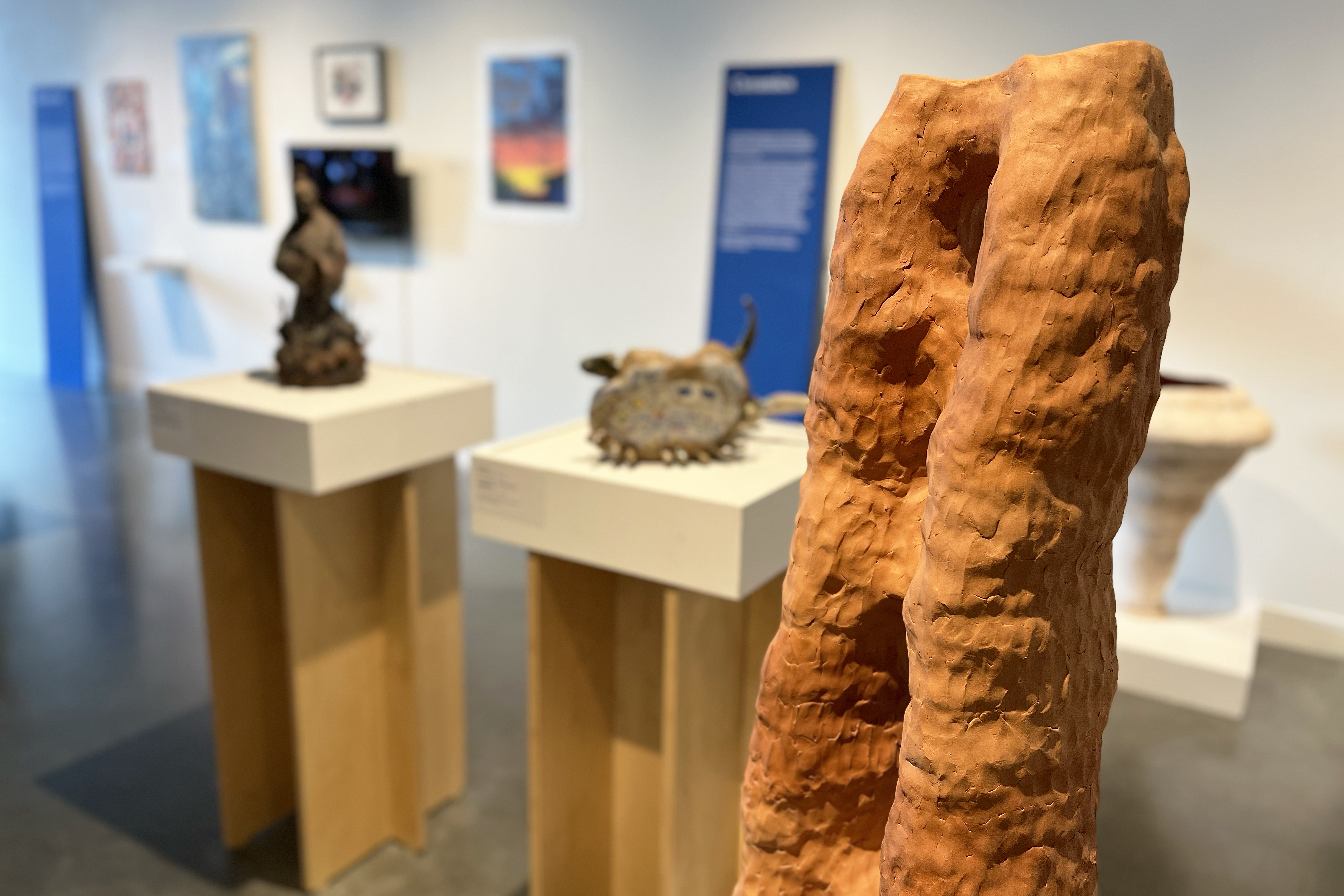 ceramics work on view including a terra cotta piece that resembles a desert rock formation