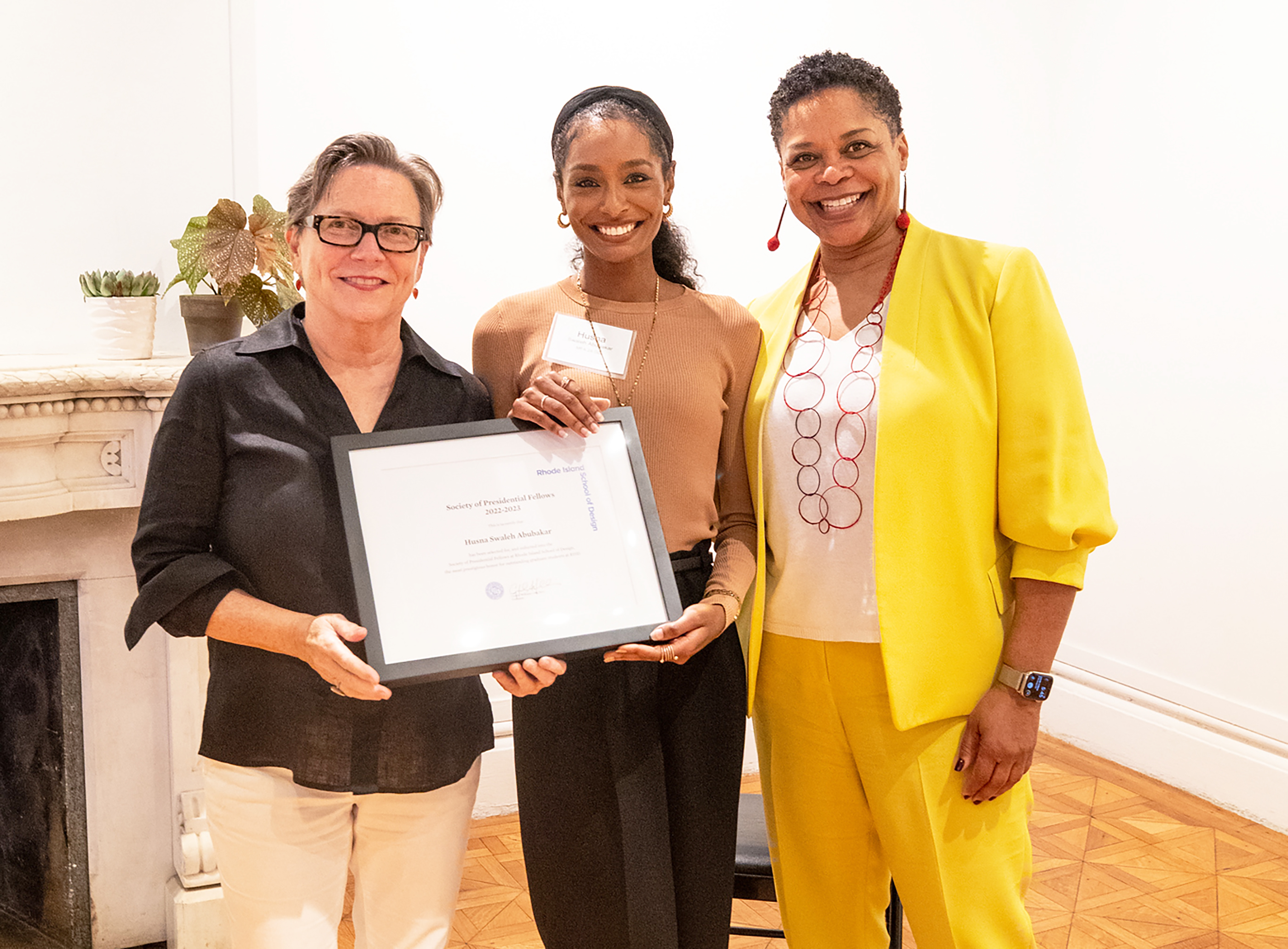 Graduate Program Director for Graphic Design, presidential fellow Husna Swaleh Abubakar and President Crystal Williams smile for the camera