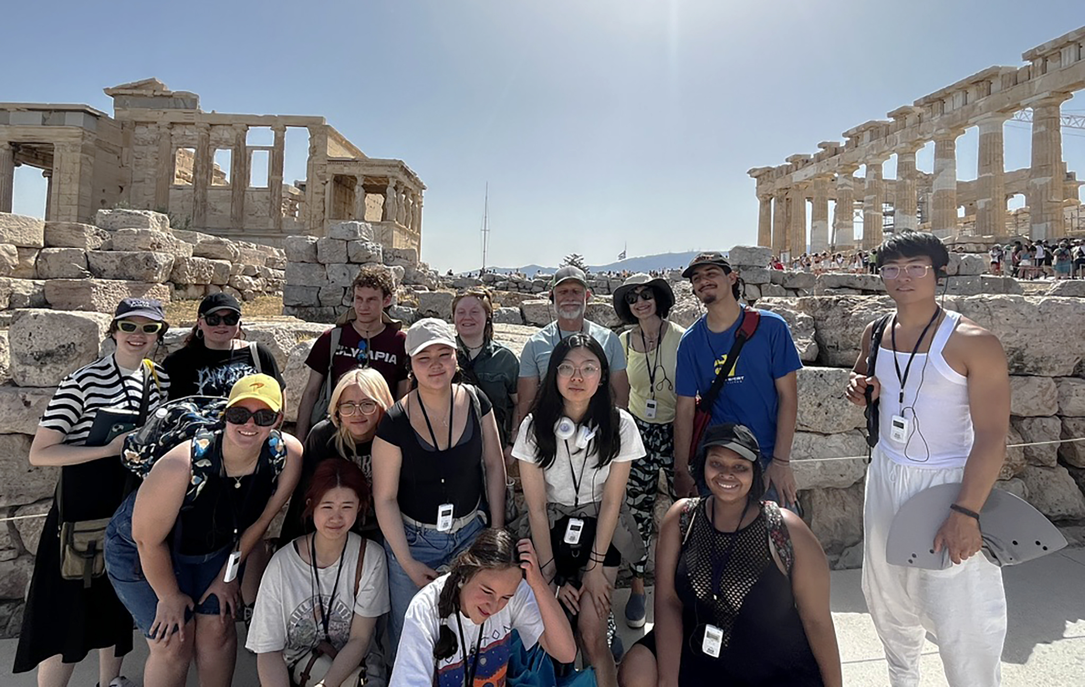 group shot in front of classic Greek ruins