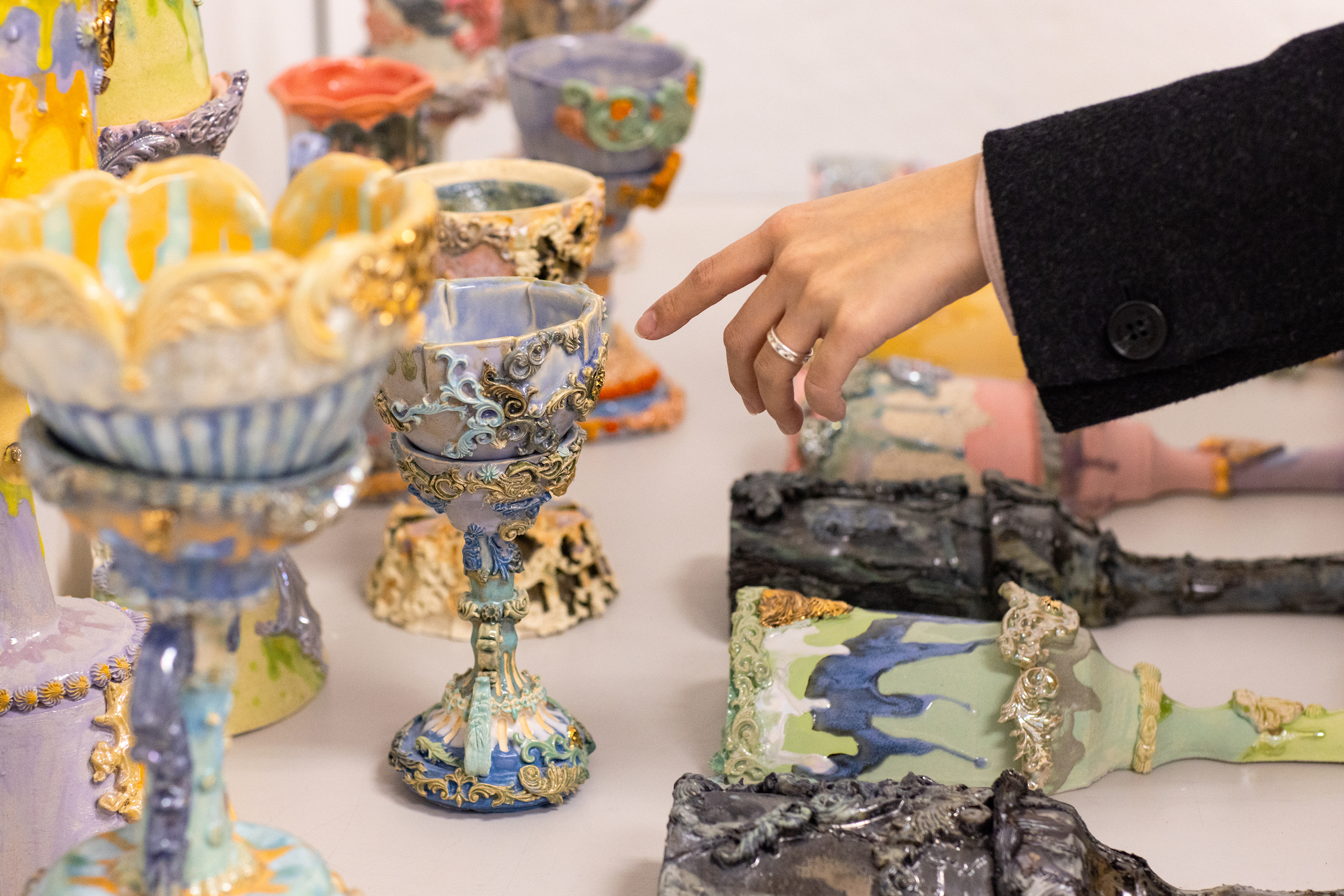 a colorful collection of ceramics for the show