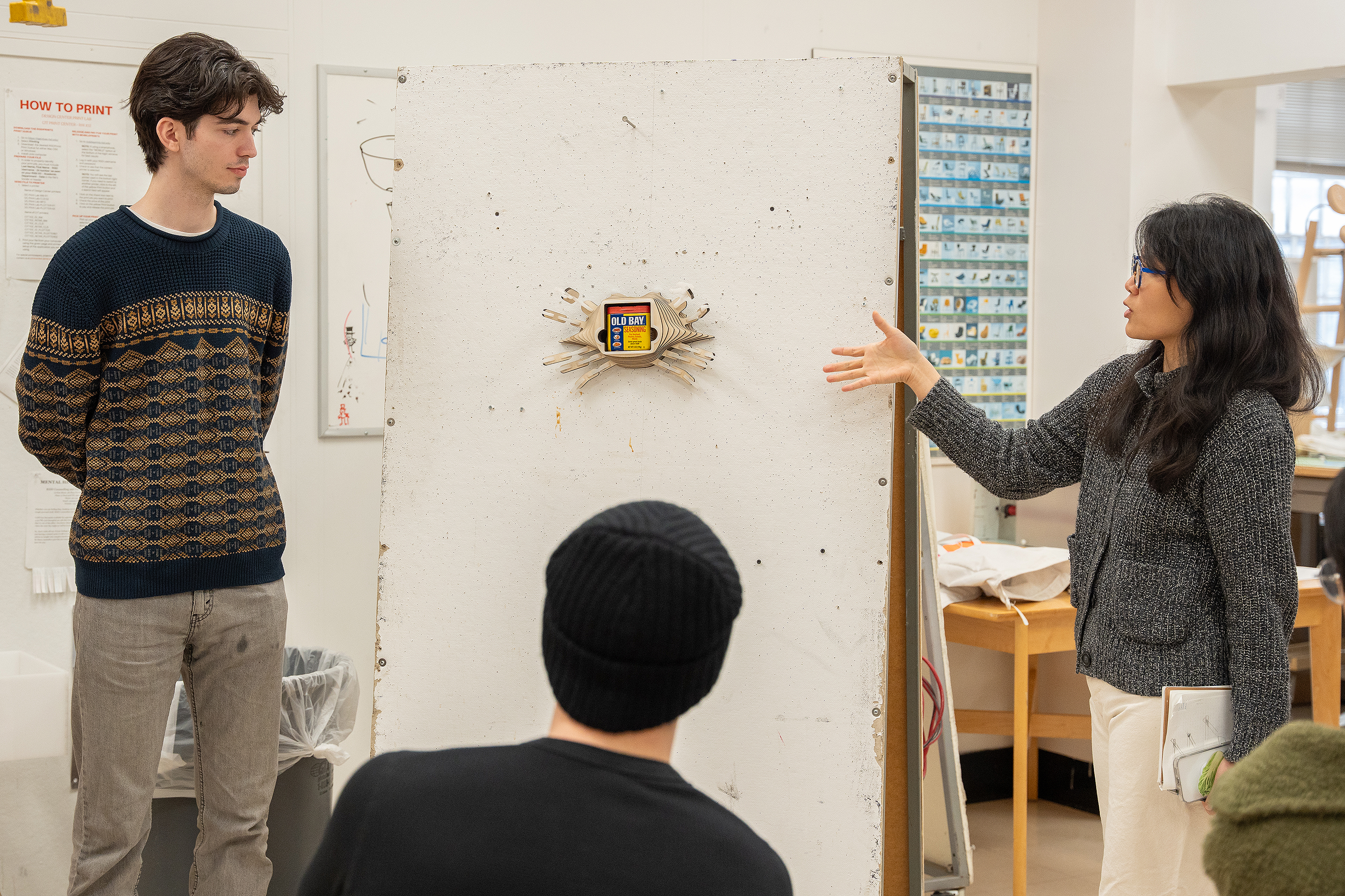 Choi critiques a shelf intended to hold Old Bay spice container