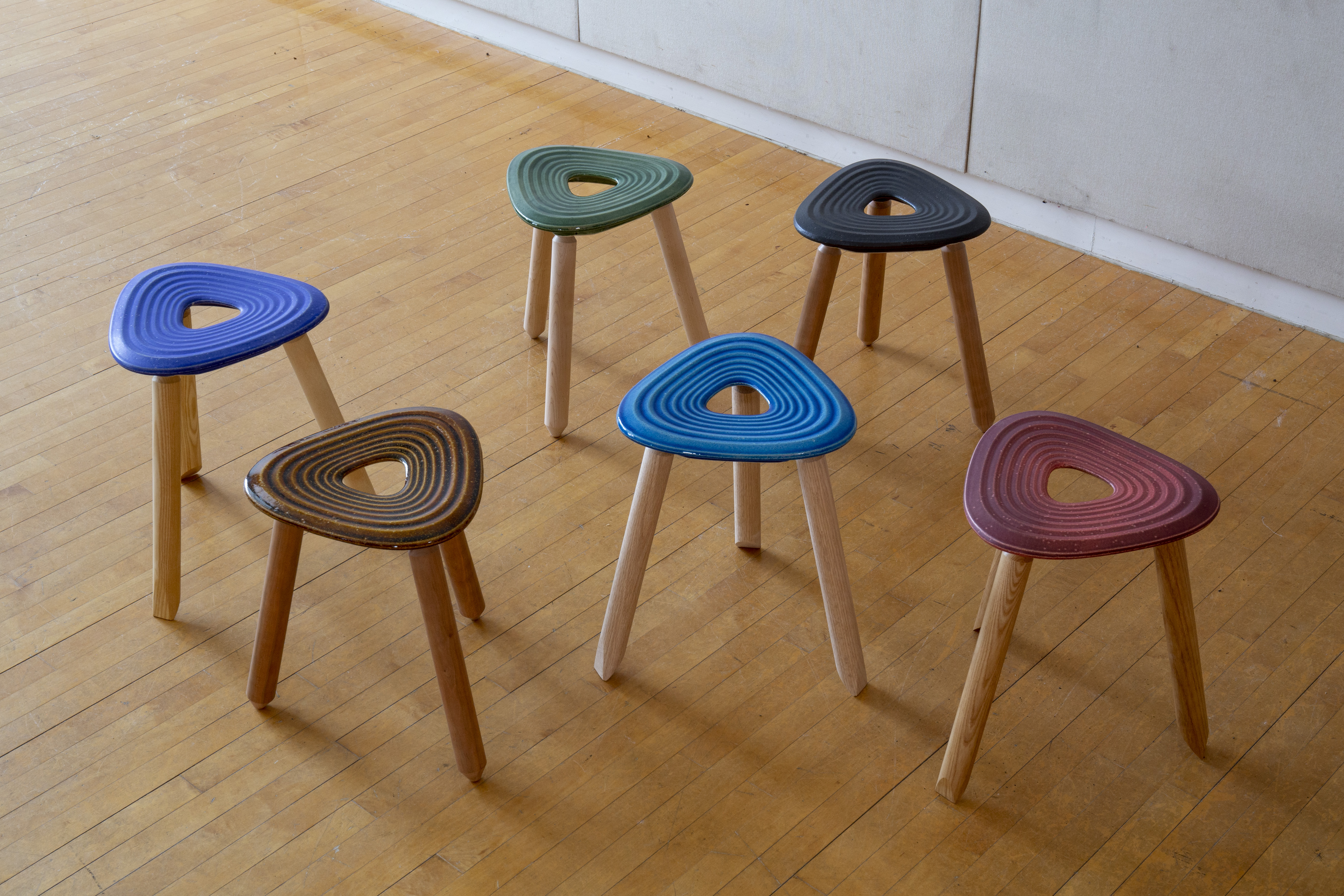 colorful three-legged stools