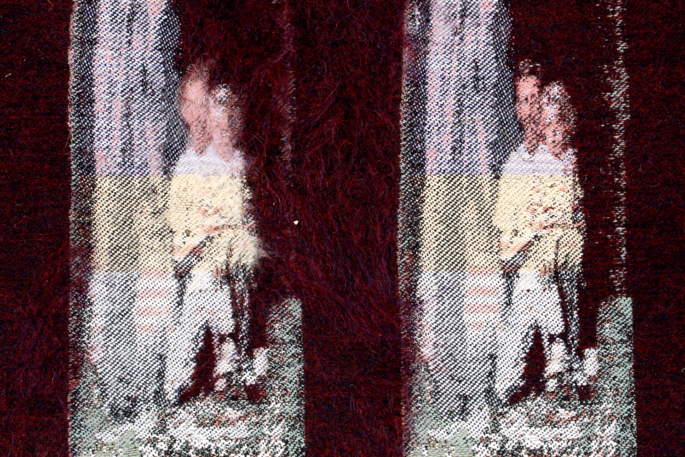 textile with image of girl and her father woven in