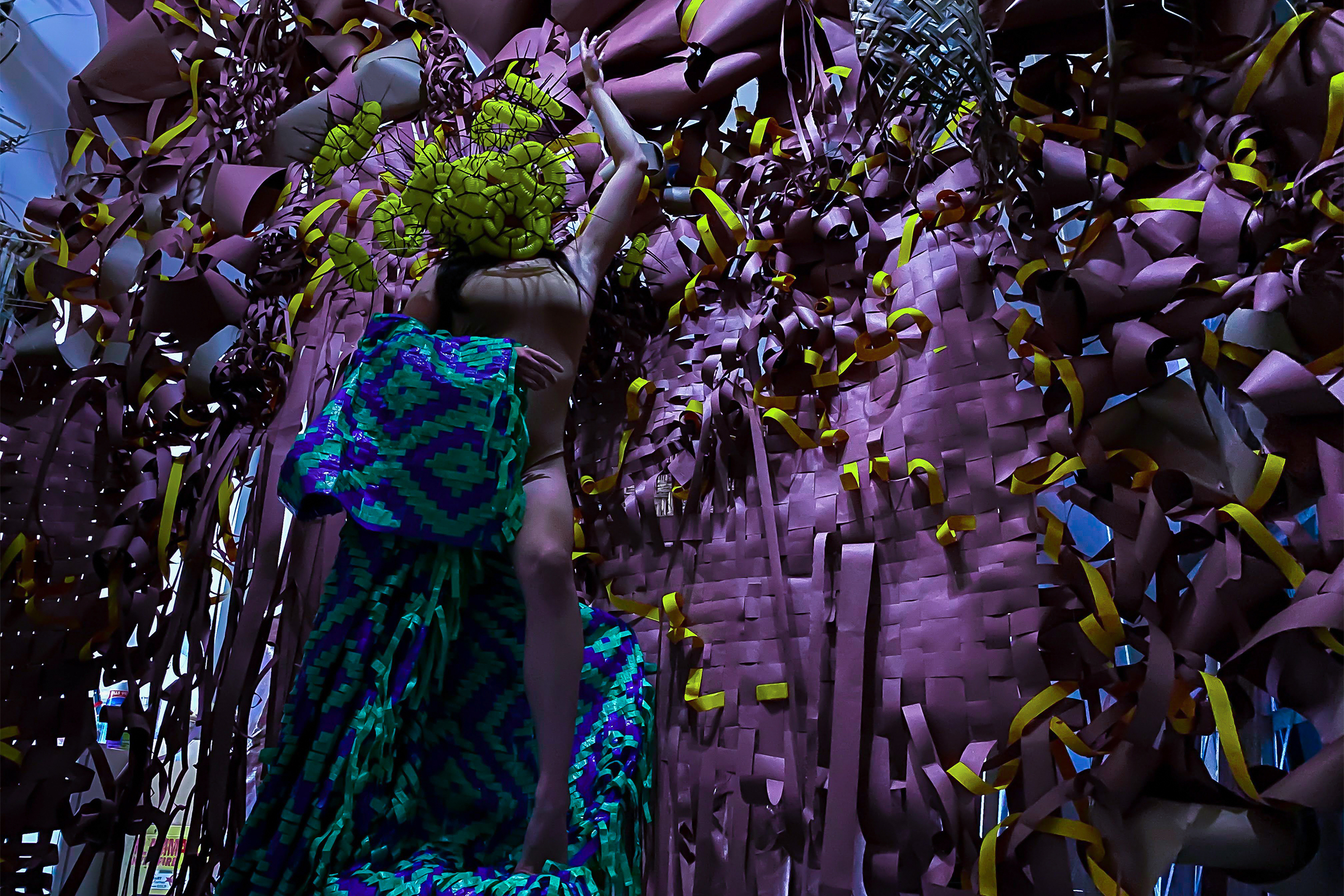 still from performance featuring woven grasses and rattans