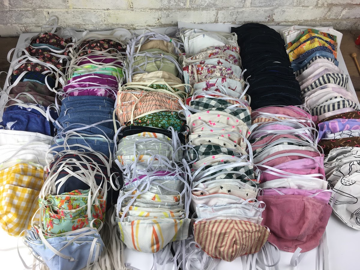 Many cloth face masks of different colors