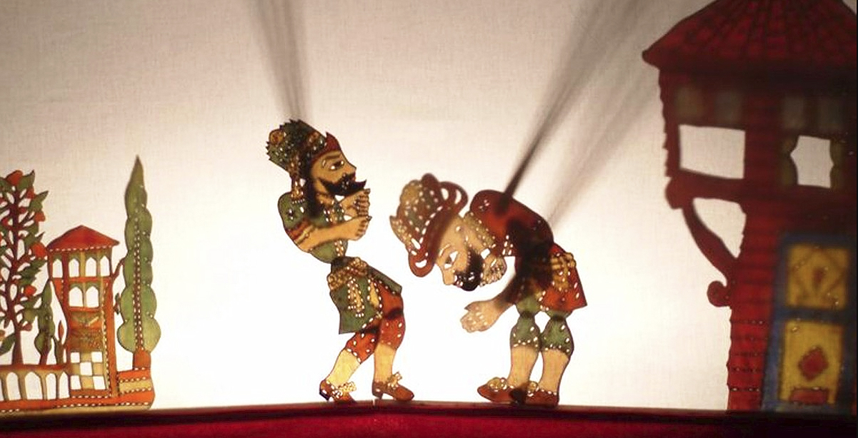 Karagoz puppets cast shadows on stage
