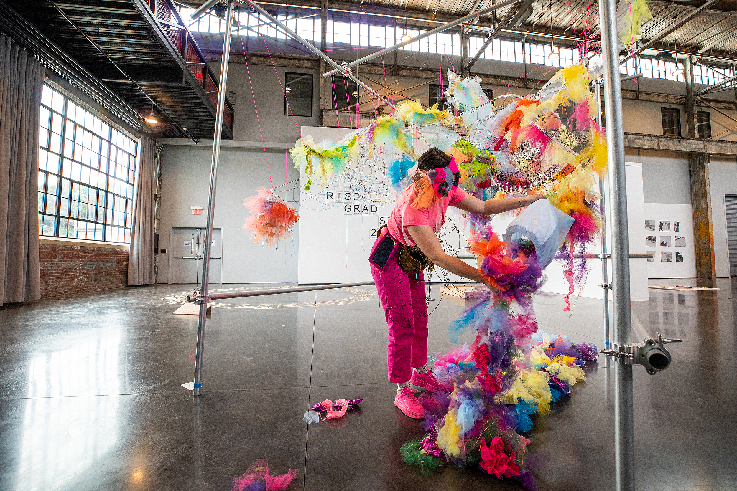a grad student installs her work at RISD's Grad Show