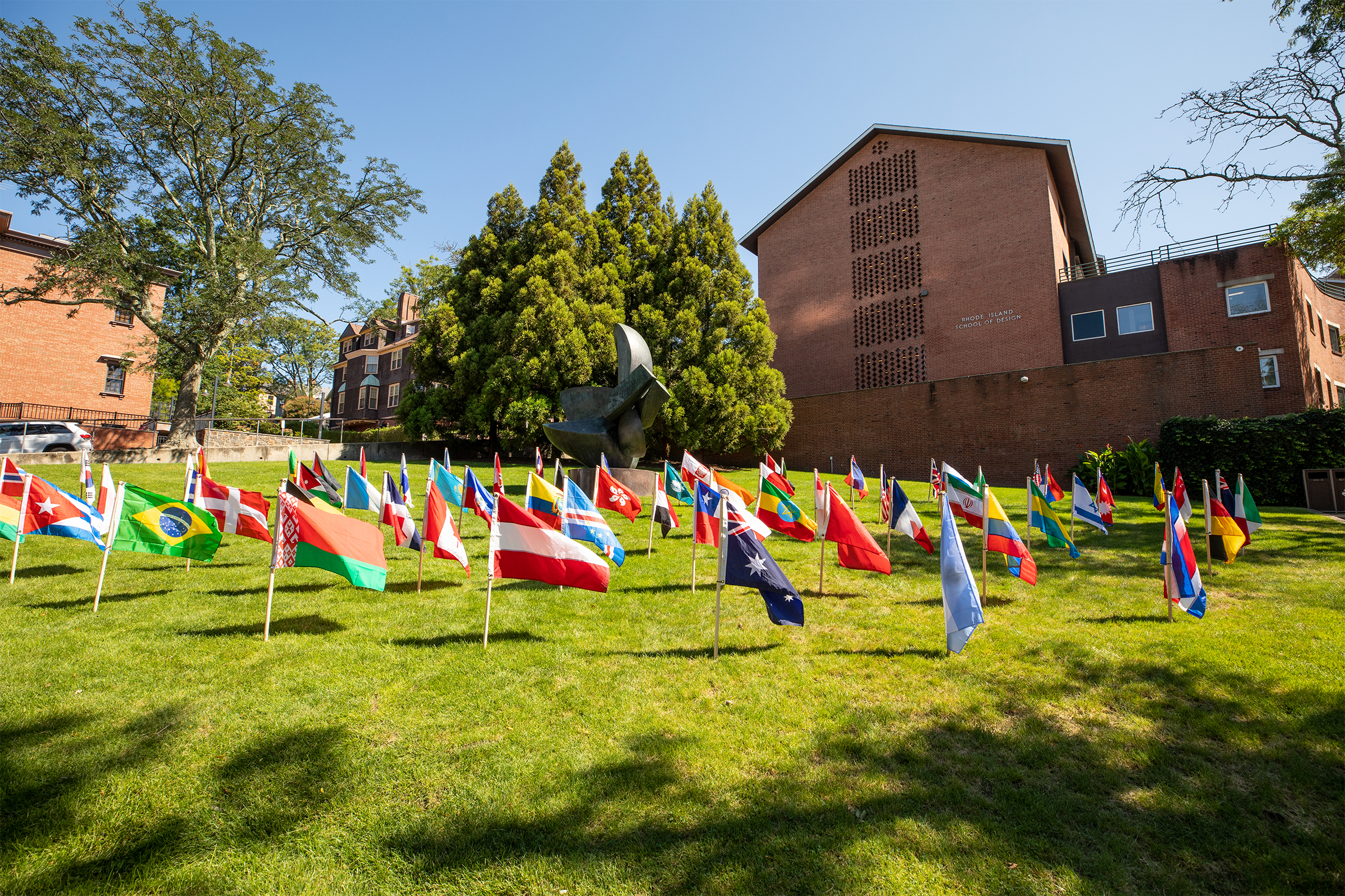 an array of international flags decorate RISD Beach on move-in day