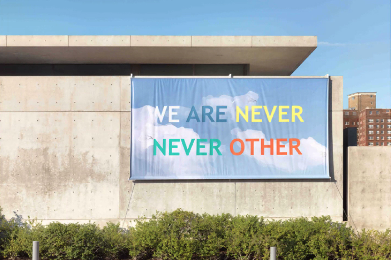 A massive banner that reads We Are Never Never Others