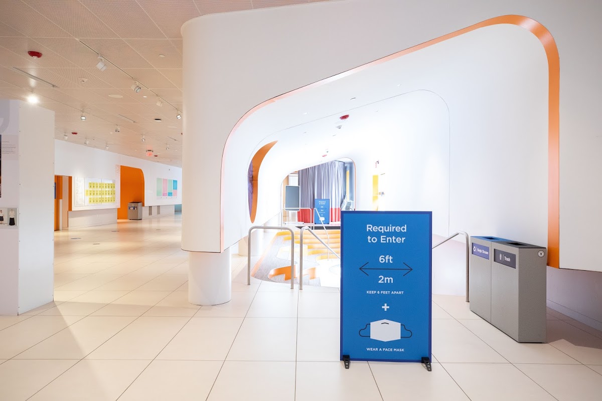 Main floor of 20 Washington Place Student Center with prominent public health signage