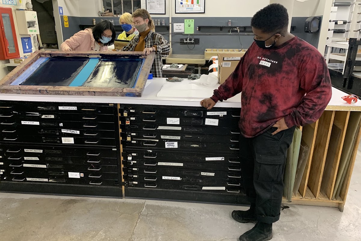 Printmaking students showing their workspaces and tools in Benson Hall.