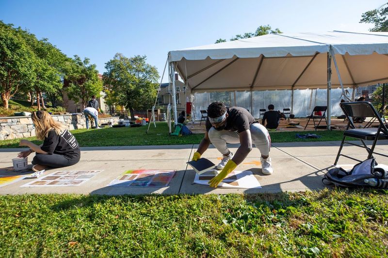 Students working in a studio course that moved outdoors