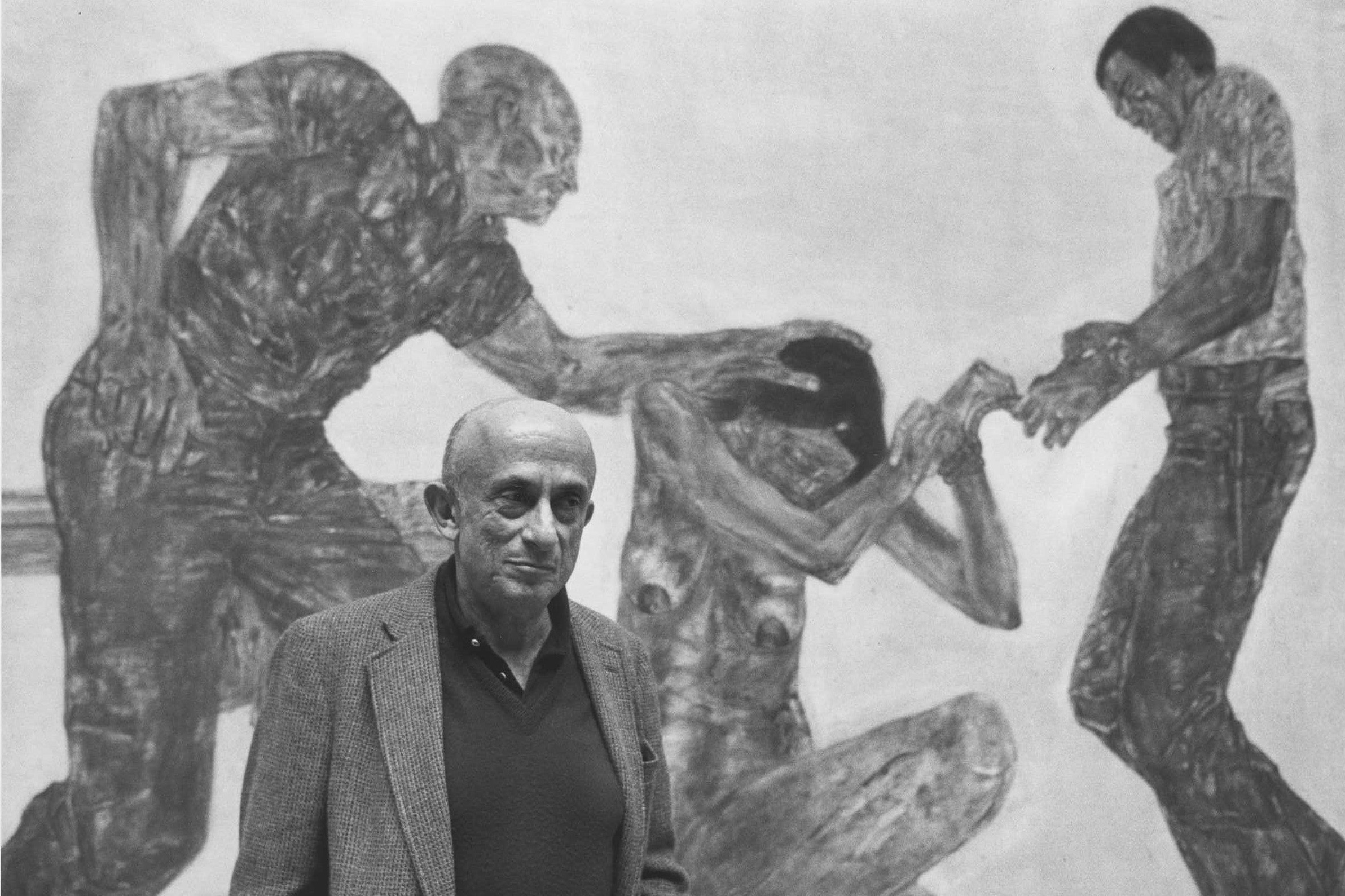 painter Leon Golub poses with a painting