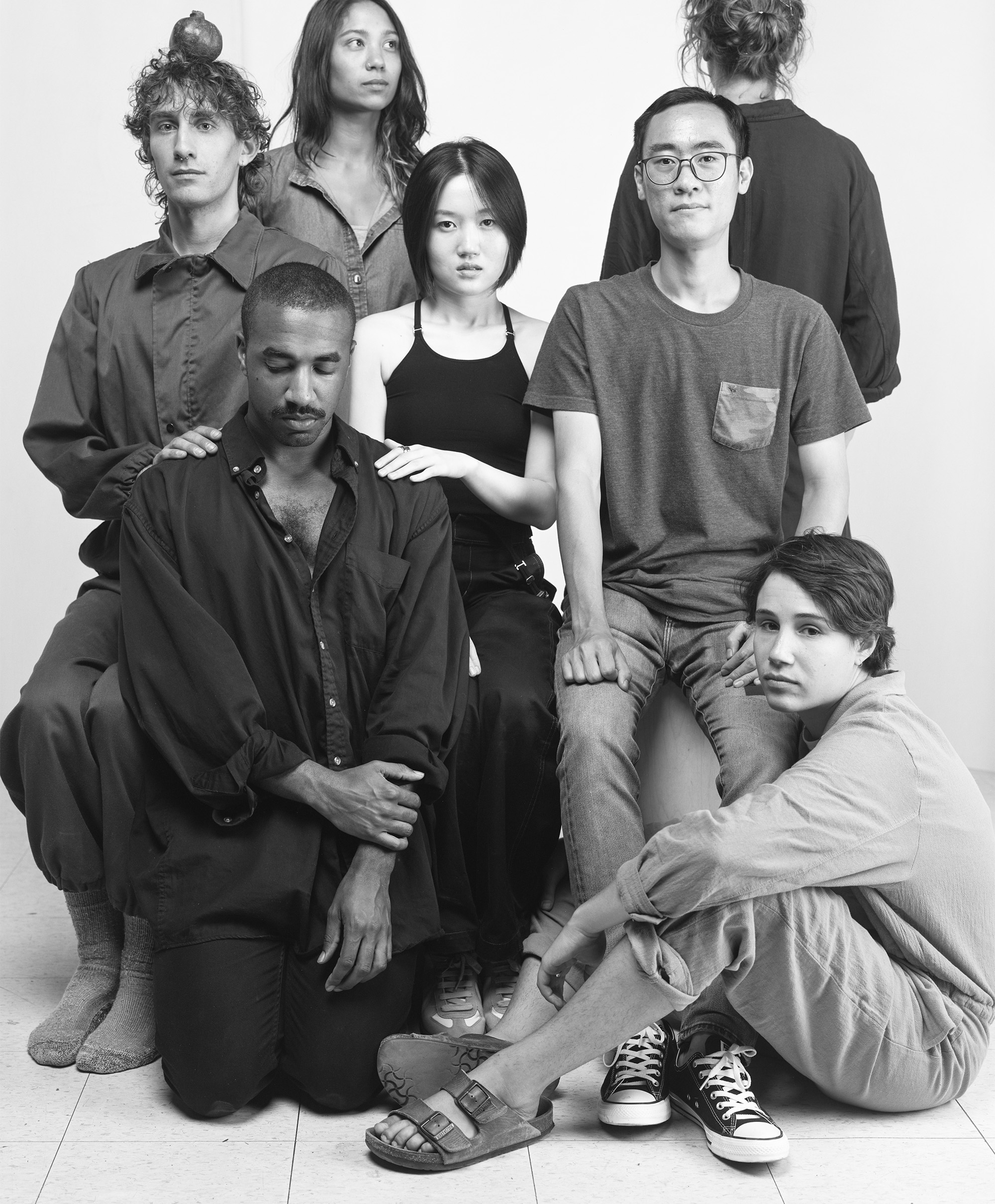 black-and-white portrait of seven members of the Photography MFA class of 2022