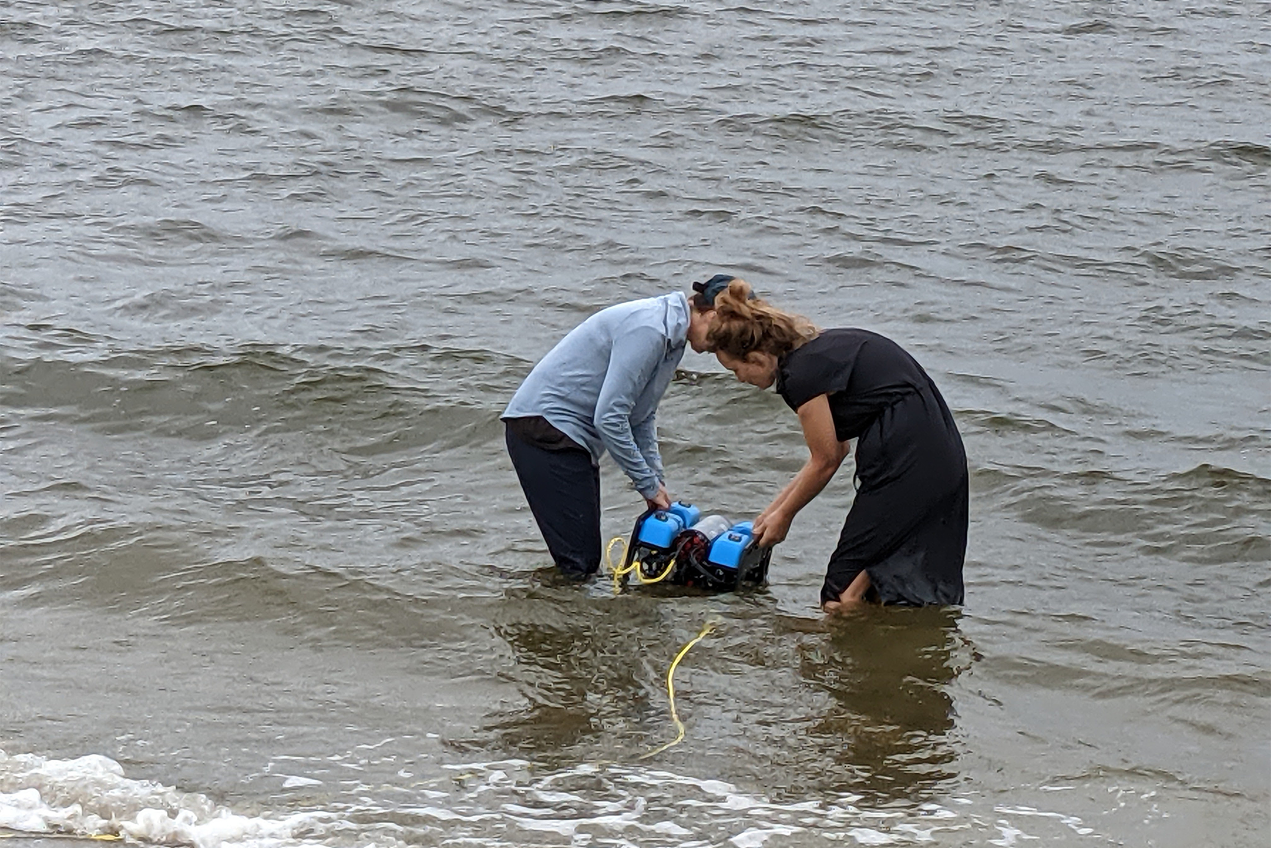 Rhodes and Kitchen wade into the bay with a ROV