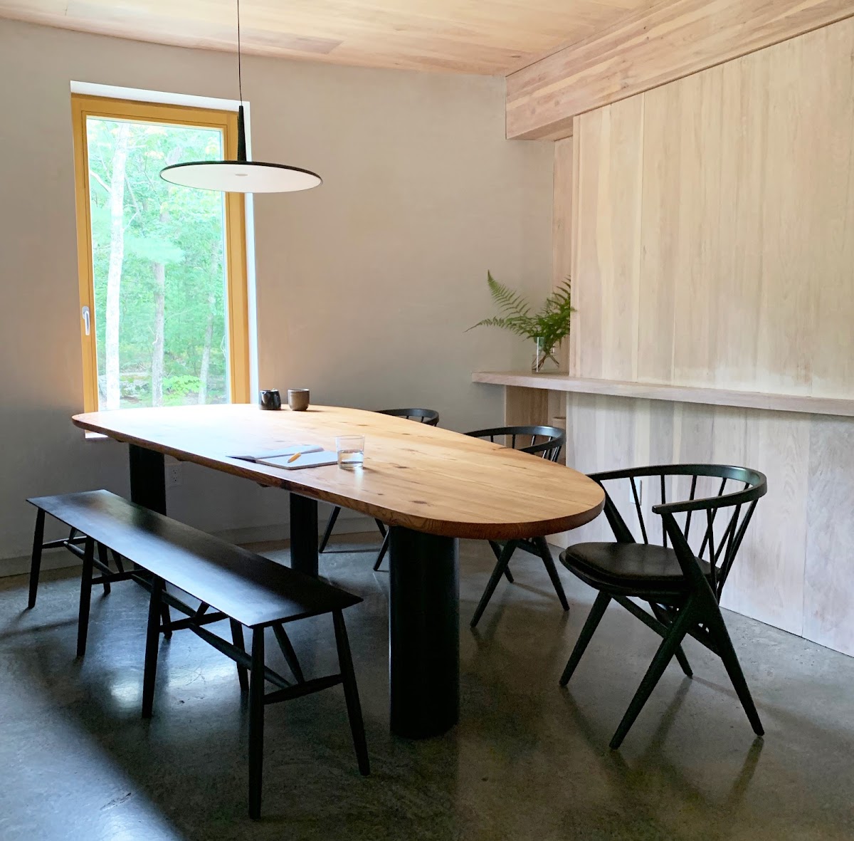 Custom table in kitchen of an energy-efficient home by Laura Briggs BArch 82, Jonathan Knowles BArch 84, and Jonsara Ruth 92 ID.