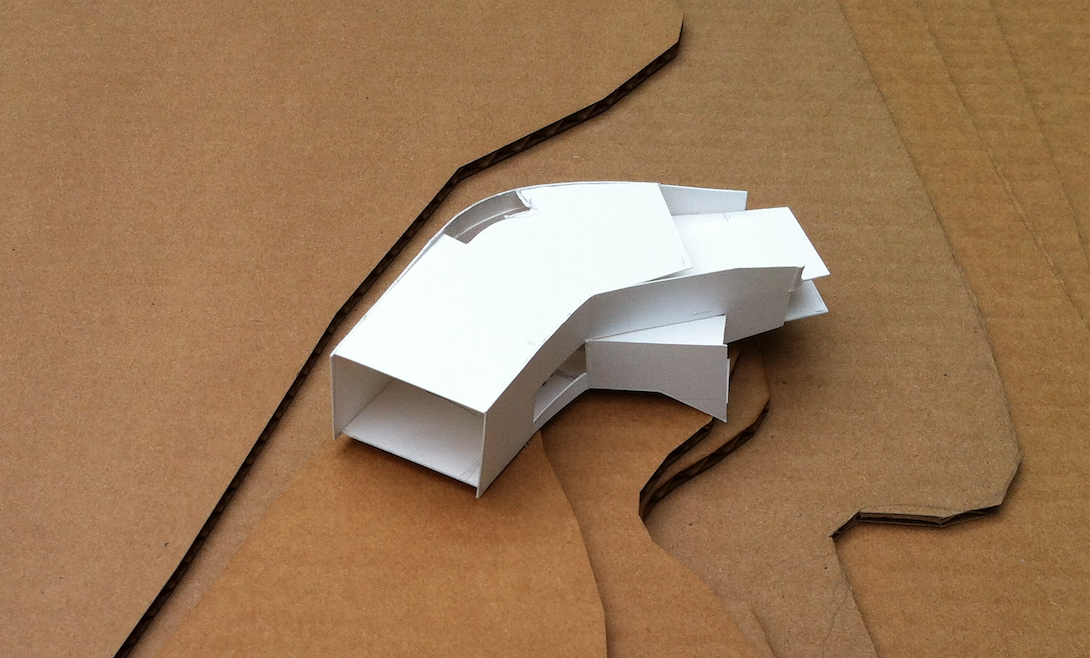 Paper model with topography map for an energy-efficient home by Laura Briggs BArch 82, Jonathan Knowles BArch 84, and Jonsara Ruth 92 ID.
