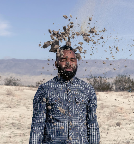 Photo of person outside with clumps of dirt flying, by Tavares Strachan 03 GL