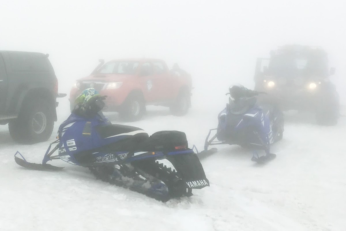 Snowmobiles in white-out conditions