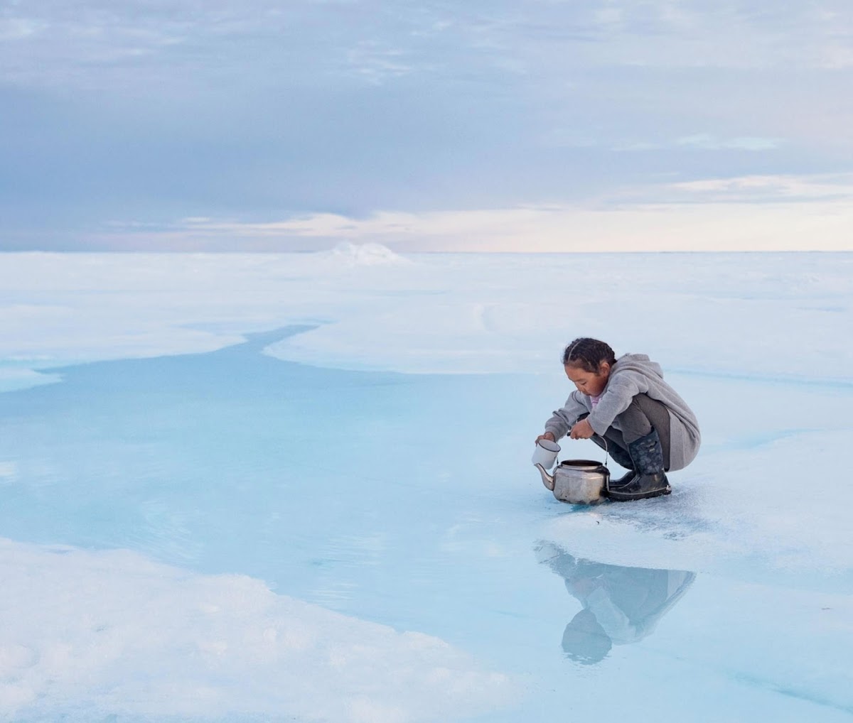 Acacia Johnson 14 PH photograph of Inuit child getting water on the ice