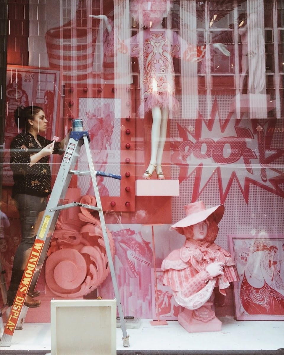 Kelly C. Knapp MLA 10 installing a historic fashion-themed window display for Bergdorf Goodman