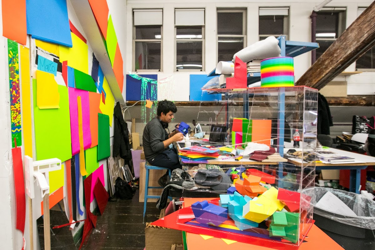 Student working in a colorful studio