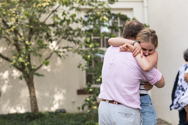 A student hug's her father goodbye before the semester kicks off