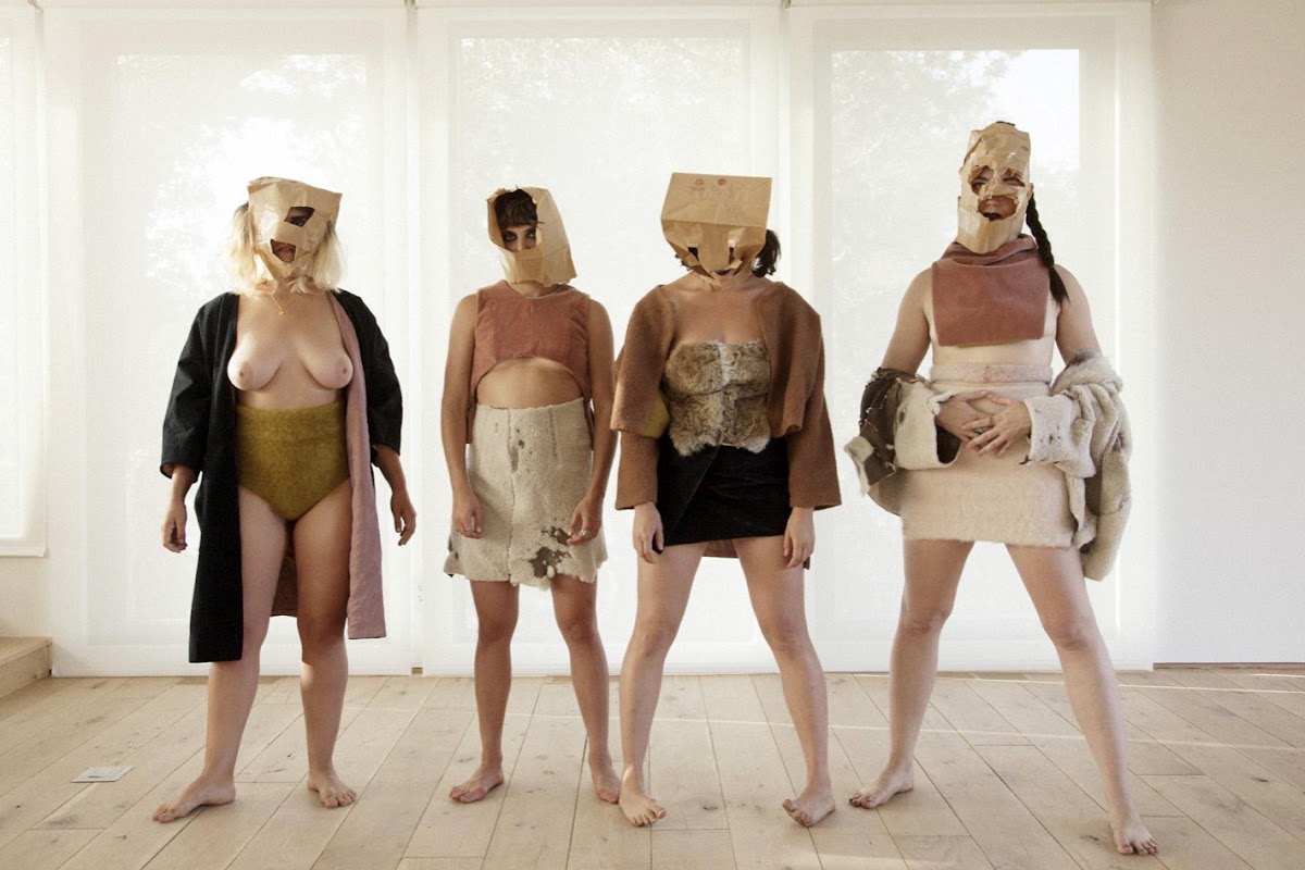 Masked semi-nude models wearing Mike Eckhaus 10 SC and Zoe Latta 10 TX apparel