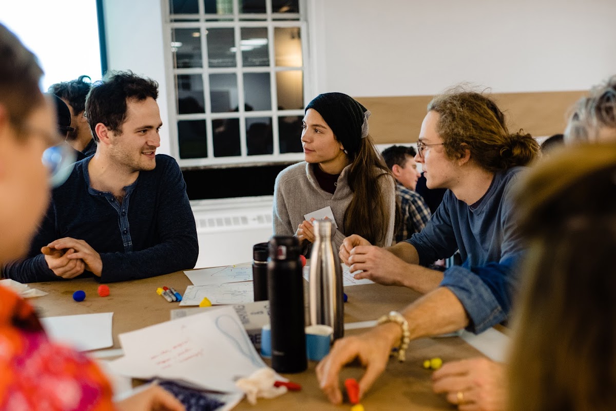 Participants discuss an exercise at the Center for Complexity workshop