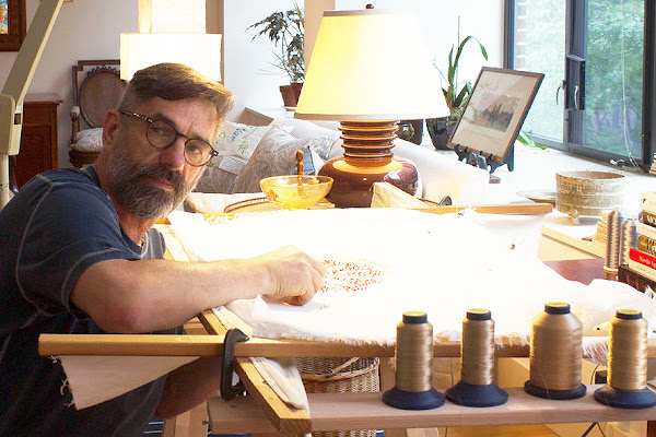 Textiles faculty member Michael Savoia at work in his custom embroidery company Villa Savoia