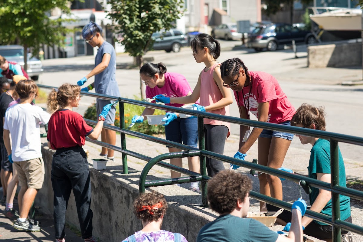 Student volunteers clean up Billy Taylor park on the East Side of Providence