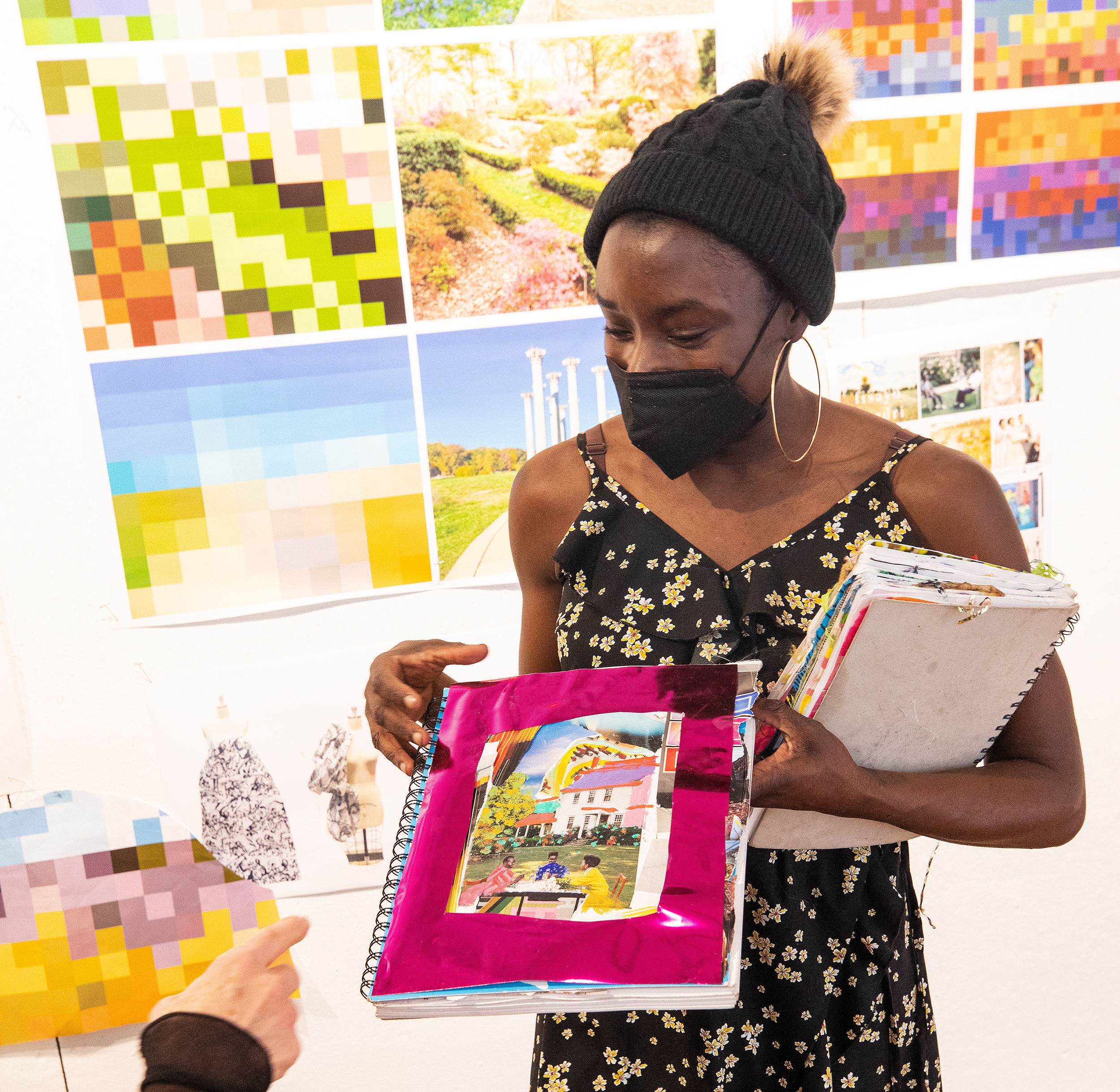 a textiles student shows a handmade book