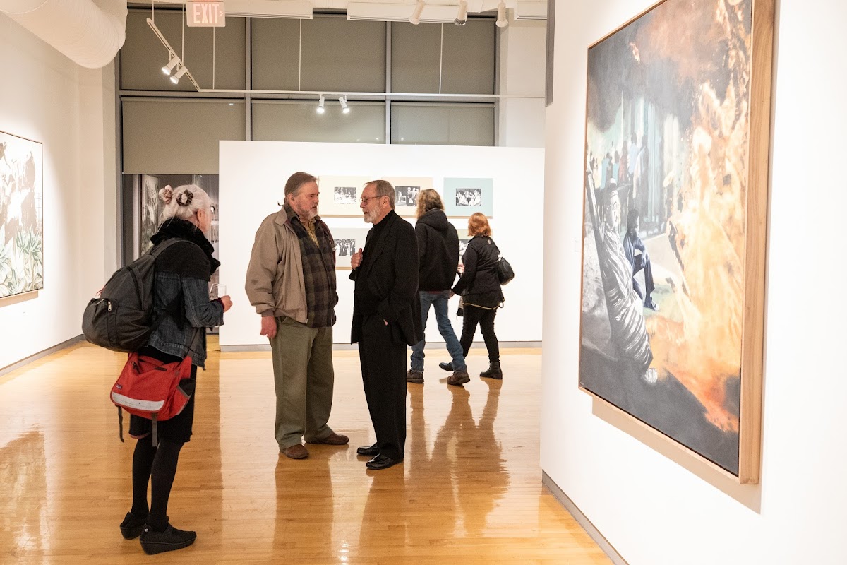 Martin Mull 65 PT/MFA 67 chats with guests at the opening reception for American Dreams