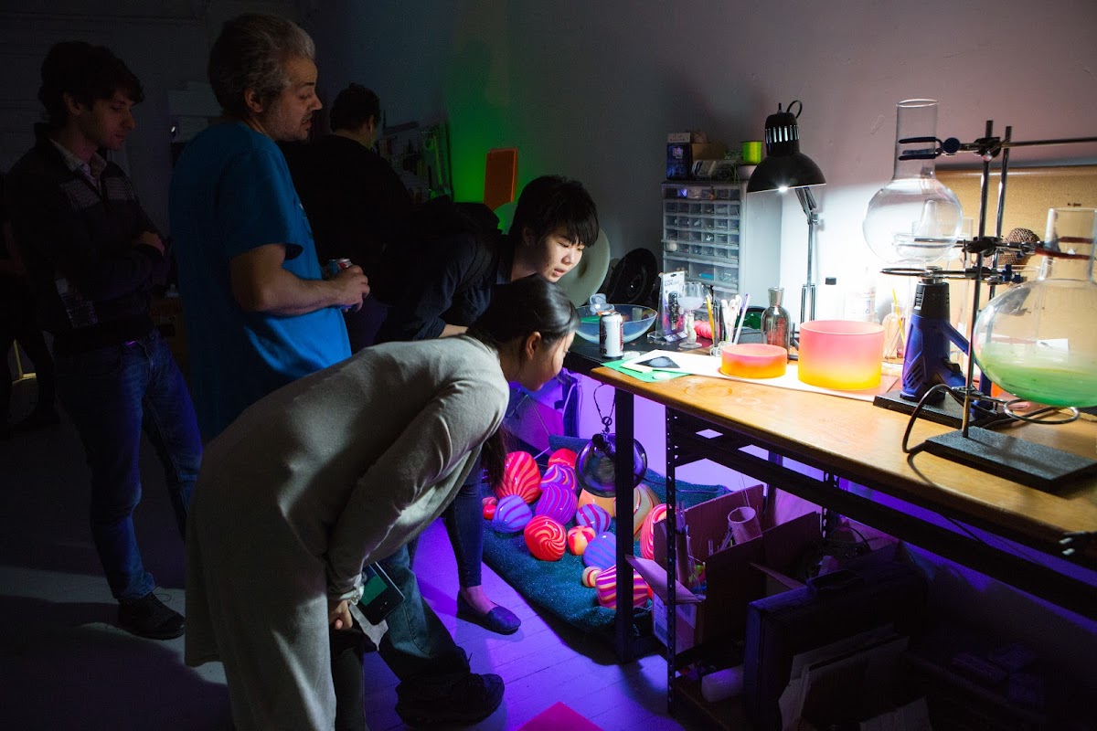 Students examining work in a studio