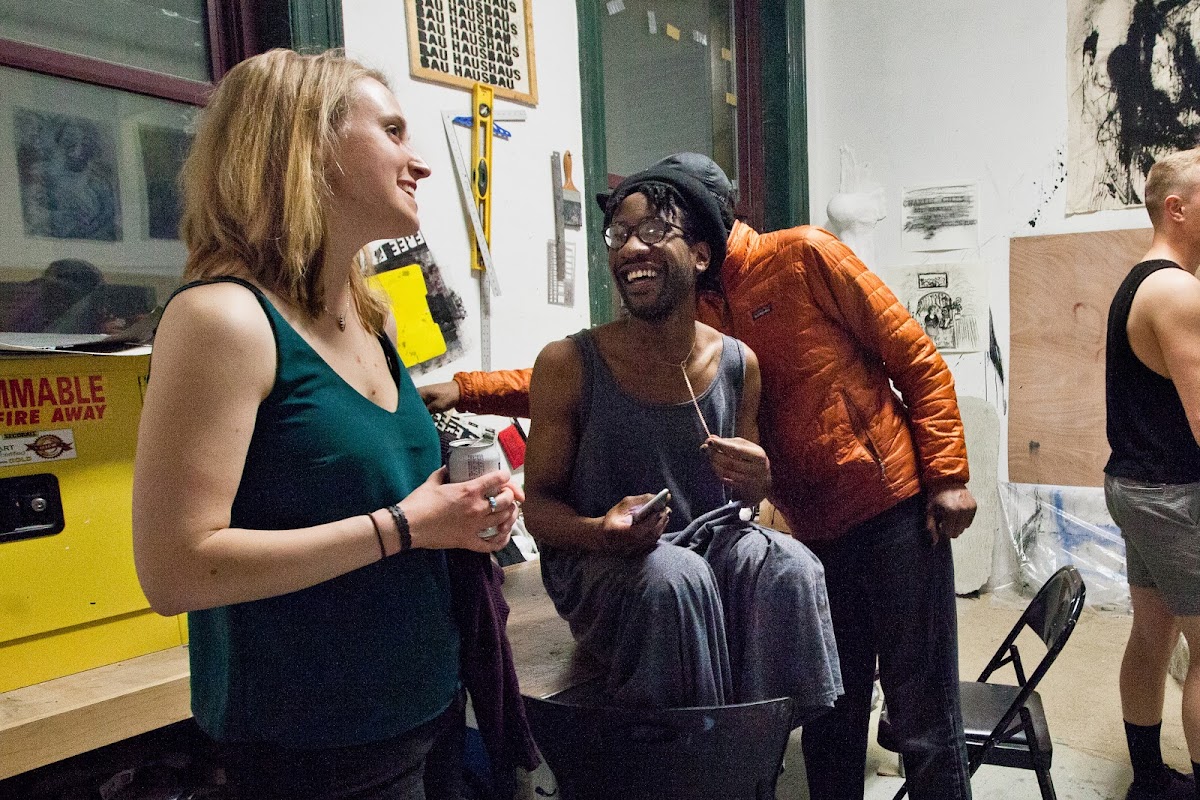 Graduate students chatting in a RISD studio