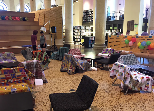 Textiles draped over chairs in the Fleet Library at RISD