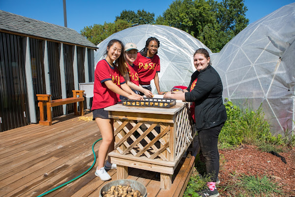 Students volunteering at the Southside Community Land Trust