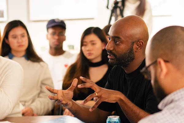 Assistant Professor Emanuel Admassu talking with students